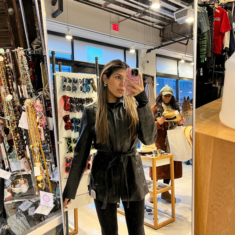 Long belted black leather coat